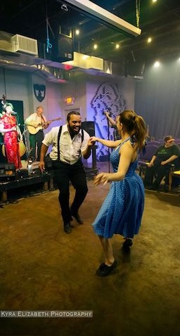 Zuzu's Hot 5 on stage with swing dancers